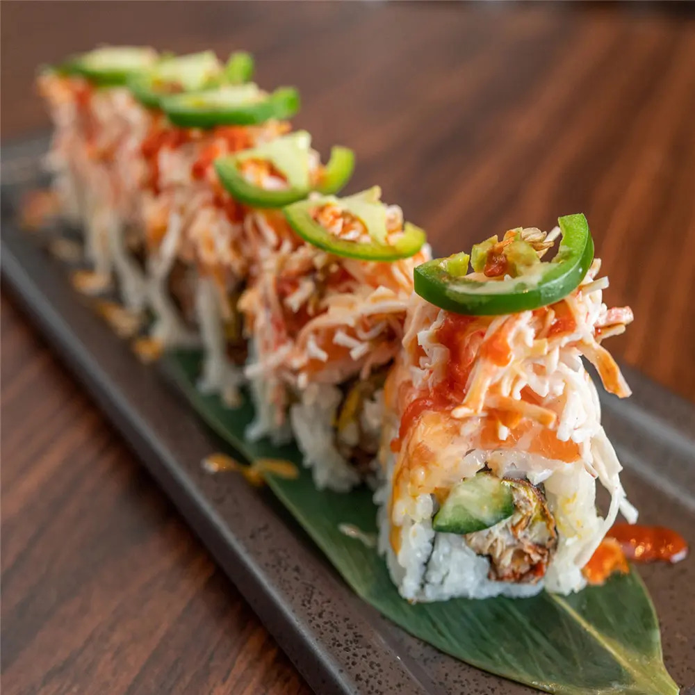 MJ-Sushi-Palo-Alto-Japanese-restaurant-Crab-Meat-and-Jalapeño-Sushi-CA Crab Meat and Jalapeño Sushi features sushi rolls topped with shredded crab meat, slices of jalapeño, and a drizzle of sauce at MJ Sushi - Palo Alto, a Japanese restaurant in CA
