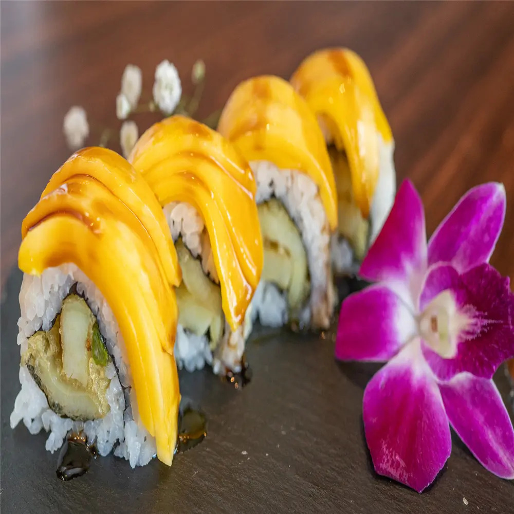 Mango Sushi is made with sushi rolls topped with fresh mango slices at MJ Sushi - Palo Alto, a Japanese restaurant in CA