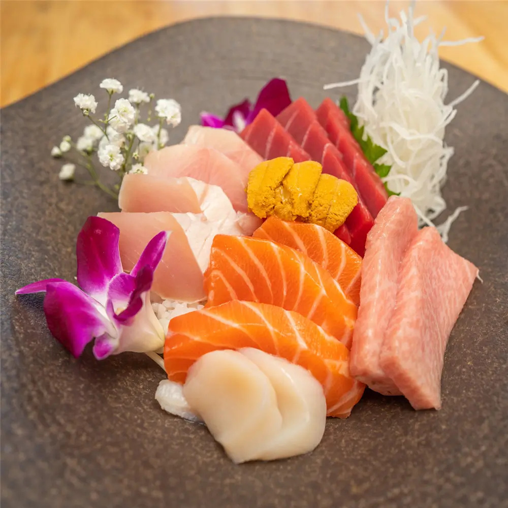 Assorted Sashimi presents a platter of various fresh raw fish slices, including salmon, tuna, and scallop at MJ Sushi - Palo Alto, a Japanese restaurant in CA
